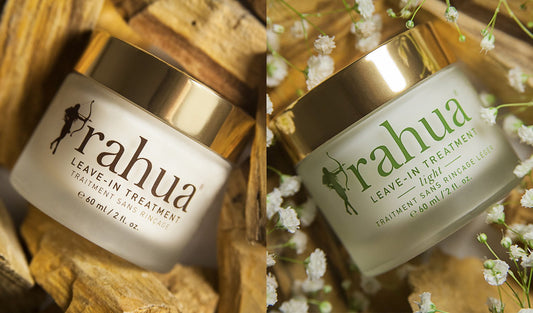 Rahua Leave in treatment and leave in treatment light boxes placed in between small wooden blocks and white flowers