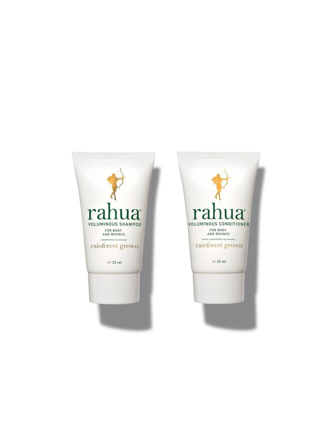 two bottles of rahua voluminous shampoo and conditioner with gold caps and white labels with green lettering. there's a sticker in the upper right with "beauty inc. the greatest hair care 2025"|variant:074-oz
