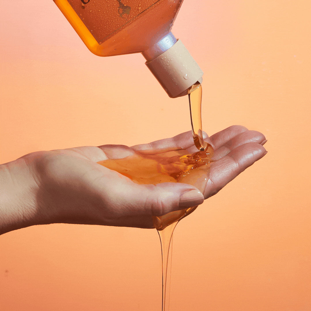 enchanted island shampoo pouring on hand