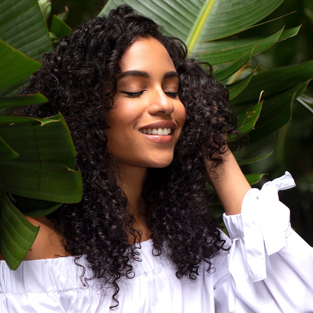 woman curly smooth hair with leaves